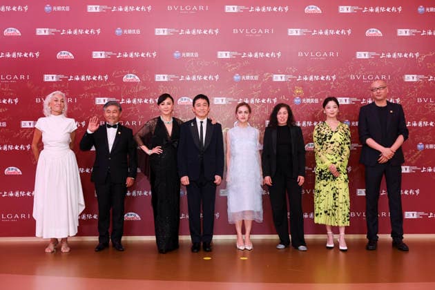 SHANGHAI, CHINA - JUNE 20: Jury members actor Tony Leung Chiu-wai and his wife Carina Lau Kar-ling, producer Dora Bouchoucha Fourati, director Guan Hu, director Aktan Abdykalykov, director-screenwriter Dea Kulumbegashvili, screenwriter Fernanda Valadez and actress Xin Zhilei arrive at the red carpet of the closing ceremony for the 28th Shanghai International Film Festival on June 20, 2026 in Shanghai, China.  Copyright: xVCGx 111649394723