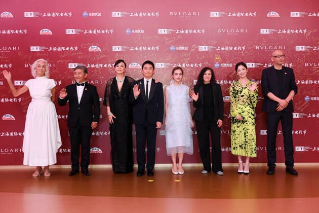 SHANGHAI, CHINA - JUNE 20: Jury members actor Tony Leung Chiu-wai and his wife Carina Lau Kar-ling, producer Dora Bouchoucha Fourati, director Guan Hu, director Aktan Abdykalykov, director-screenwriter Dea Kulumbegashvili, screenwriter Fernanda Valadez and actress Xin Zhilei arrive at the red carpet of the closing ceremony for the 28th Shanghai International Film Festival on June 20, 2026 in Shanghai, China.  Copyright: xVCGx 111649394741