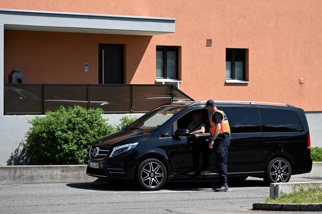 (260621) -- BURGENSTOCK, June 21, 2026 -- A police officer stands guard at the entrance to the road leading to a hotel complex in Burgenstock near Lucerne, Switzerland, June 20, 2026. Switzerland on Saturday said that it continues to provide a discreet and reliable setting to facilitate talks at the central Swiss resort of Burgenstock on the implementation of the Memorandum of Understanding between the United States and Iran. ) SWITZERLAND-BURGENSTOCK-U.S.-IRAN TALKS-RELIABLE SETTING LianxYi 
