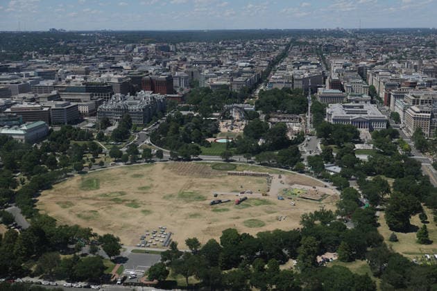 WASHINGTON, D.C. - JUNE 20: Workers clean the DC Ellipse lawn after the UFC Freedom 250 event on June 20, 2026 in Washington D.C. Copyright: xmpi34x