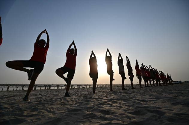 June 21, 2026, Prayagraj, Uttar Pradesh, India: Prayagraj: People take part in a Yoga session at Bank of River Ganga on the occasion of 12th International Yoga Day, in Prayagraj on Sunday, June 21, 2026. Prayagraj India - ZUMAv115 20260621_zap_v115_001 Copyright: xPrabhatxKumarxVermax