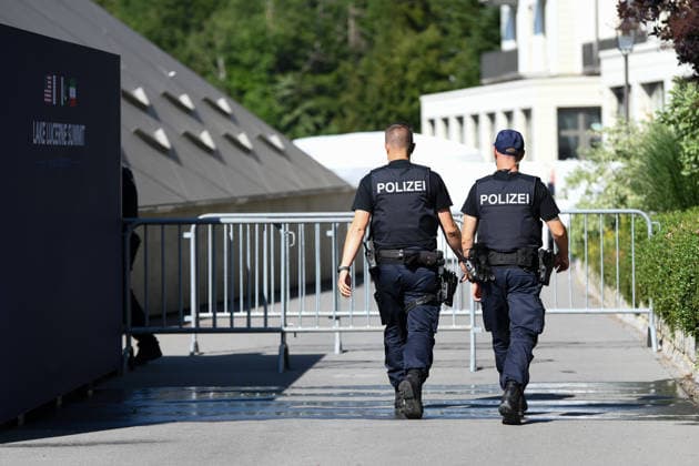 (260621) -- BUERGENSTOCK, June 21, 2026 -- Police officers stand guard in Buergenstock near Lucerne, Switzerland, June 21, 2026. Technical-level talks between the United States and Iran under the Islamabad Memorandum of Understanding (MoU) is held here on Sunday. ) SWITZERLAND-BUERGENSTOCK-U.S.-IRAN TALKS LianxYi 