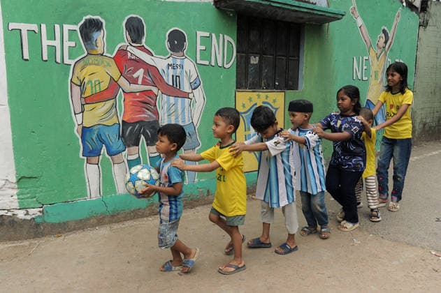 FIFA WORLD CUP 2026 - Brazil Goli (Corridor) in Chattogram, Bangladesh. Chattogram, Bangladesh - Local children, passionate supporters of Brazil s national football team, made friendship train, pose in front of a vibrant mural featuring Brazilian football stars in Brazil Goli (Corridor) at Bahaddarhat Khatib Para. The narrow alley, decorated with Brazilian flags, colors, and football-themed artwork, has become a unique gathering place for football enthusiasts and a symbol of Bangladesh s enduring love for Brazilian football, especially during major international tournaments., Credit:Md Rafayat Haque Khan Mohammed Rafayat Haque Khan Avalon Bangladesh, Chattogram  Copyright: xMdxRafayatxHaquexKhanx xMohammedxRafayatxHaquexKhanx xAvalonx 1111628771
