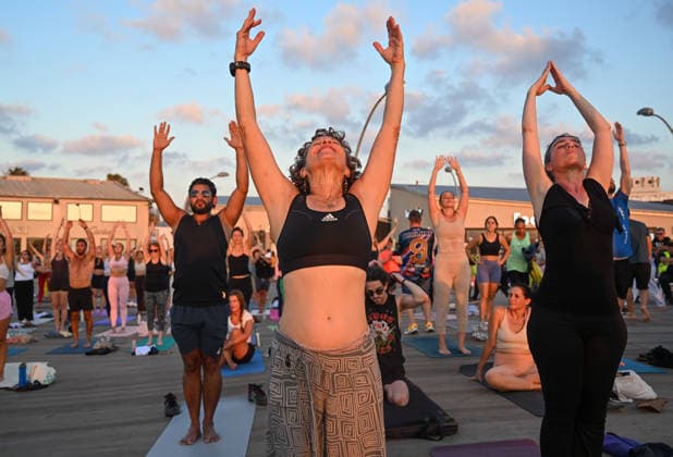 June 21, 2026, Tel-Aviv, Tel-Aviv, Israel: Hundreds of participants practice yoga during International Yoga Day at the Tel Aviv Port in Tel Aviv, joining an open public session featuring 108 Sun Salutations (Surya Namaskar), a traditional sequence symbolizing mindfulness, endurance and gratitude. Tel-Aviv Israel  - ZUMAp227 20260621_zip_p227_017 Copyright: xPaulinaxPatimerx