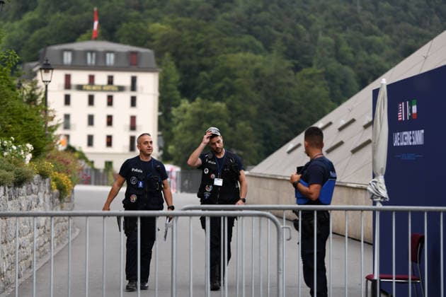 (260622) -- BURGENSTOCK, June 22, 2026 -- Police officers walk out of a hotel complex to the media center in Burgenstock near Lucerne, Switzerland, June 21, 2026. The Iranian delegation left negotiations with the United States in Switzerland on Sunday in protest of U.S. President Donald Trump s threat to launch further strikes against Iran, Iran s semi-official Tasnim news agency reported. ) (SpotNews) SWITZERLAND-BURGENSTOCK-U.S.-IRAN TALKS LianxYi 