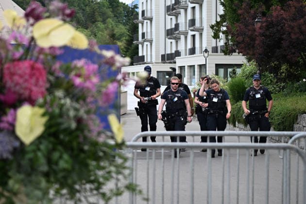 (260622) -- BURGENSTOCK, June 22, 2026 -- Police officers walk out of a hotel complex to the media center in Burgenstock near Lucerne, Switzerland, June 21, 2026. The Iranian delegation left negotiations with the United States in Switzerland on Sunday in protest of U.S. President Donald Trump s threat to launch further strikes against Iran, Iran s semi-official Tasnim news agency reported. ) (SpotNews) SWITZERLAND-BURGENSTOCK-U.S.-IRAN TALKS LianxYi 