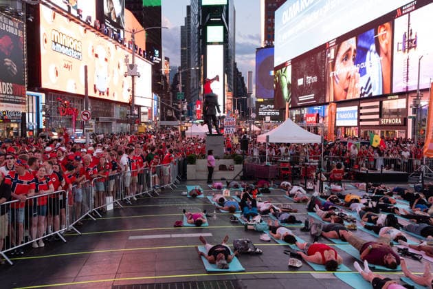 Norway national football team supporters gather in Times Square ahead of World Cup match NEW YORK, UNITED STATES - JUNE 21: A group does yoga as Norwegian national football team supporters gather on the iconic red steps in Times Square ahead of Monday s FIFA World Cup match, creating a festive atmosphere with chants and traditional rowing celebrations as fans dressed in red and waving flags filled the famous Manhattan landmark in New York, United States on June 21, 2026. Lokman Vural Elibol Anadolu New York United States. Editorial use only. Please get in touch for any other usage.  Copyright: x2026xAnadoluxLokmanxVuralxElibolx