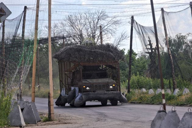 RECORD DATE NOT STATED Ukrainian Military Vehicles Travel Through Donetsk Region - Ukraine An armored vehicle equipped with a large metal cage ( barbecue armor ) and additional camouflage covering for protection against Russian FPV drone strikes travels along a road protected by anti-drone nets in Donetsk region, Ukraine, on June 20, 2026 (Photo by Nina Liashonok Ukrinform ABACAPRESS.COM) Odesa Ukraine  Copyright: xLyashonokxNina Ukrinform ABACAx