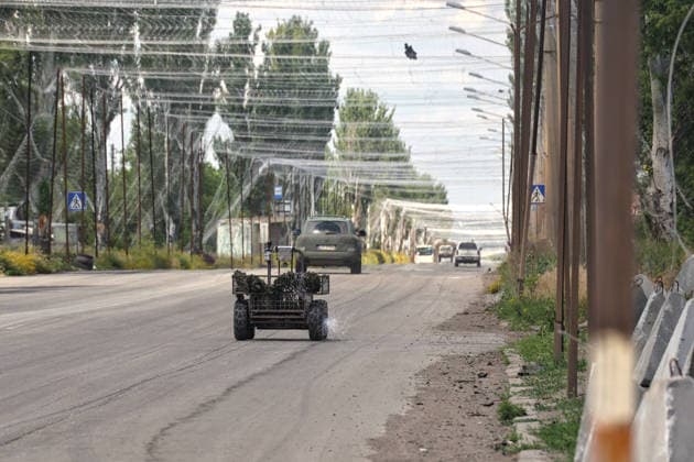 RECORD DATE NOT STATED Ukrainian Military Vehicles Travel Through Donetsk Region - Ukraine A ground drone travels along a road protected by anti-drone nets in Donetsk region, Ukraine, on June 20, 2026 (Photo by Nina Liashonok Ukrinform ABACAPRESS.COM) Odesa Ukraine  Copyright: xLyashonokxNina Ukrinform ABACAx