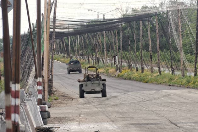 RECORD DATE NOT STATED Ukrainian Military Vehicles Travel Through Donetsk Region - Ukraine A ground drone travels along a road protected by anti-drone nets in Donetsk region, Ukraine, on June 20, 2026 (Photo by Nina Liashonok Ukrinform ABACAPRESS.COM) Odesa Ukraine  Copyright: xLyashonokxNina Ukrinform ABACAx