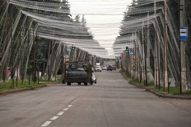 RECORD DATE NOT STATED Ukrainian Military Vehicles Travel Through Donetsk Region - Ukraine An armored military vehicle fitted with additional protection against Russian FPV drone strikes travels along a road protected by anti-drone nets in Donetsk region, Ukraine, on June 20, 2026 (Photo by Nina Liashonok Ukrinform ABACAPRESS.COM) Odesa Ukraine  Copyright: xLyashonokxNina Ukrinform ABACAx