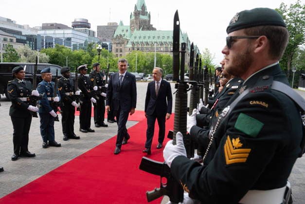 June 22, 2026, Ottawa, On, Canada: Prime Minister Mark Carney, centre right, walks with Croatian Prime Minister Andrej Plenkovic through an arrival guard outside the Mackenzie doors of West Block on Parliament Hill on Parliament Hill Monday, June 22, 2026. Ottawa Canada  - ZUMAc35_ 20260622_zaf_c35_002 Copyright: xAdrianxWyldx