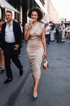IPA85954298 - Milan, Milan Fashion Week Menswear Spring Summer 2027 - Men s Fashion, Spring Summer 2027 - Giorgio Armani Fashion Show - Guests arriving. Pictured: Nathalie Emmanuel (British actress and model) walking down the street with a fan because of the heat  Copyright: xAlessandroxBremecx xx 85954298