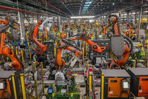 JINHUA, CHINA - JUNE 22: Industrial robots work on the production line at the workshop of new energy vehicle components enterprise on June 22, 2026 in Jinhua, Zhejiang Province of China.  Copyright: xVCGx 111649698757