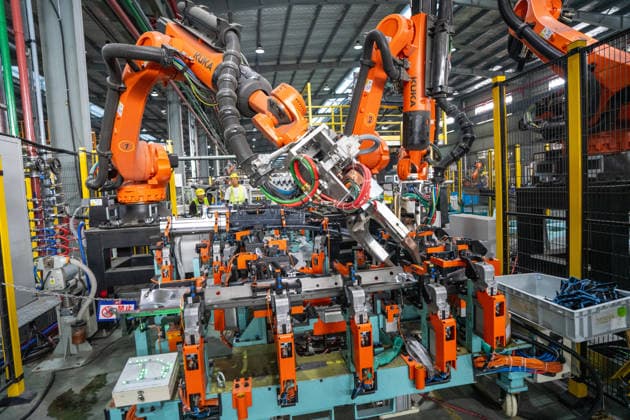 JINHUA, CHINA - JUNE 22: Industrial robots work on the production line at the workshop of new energy vehicle components enterprise on June 22, 2026 in Jinhua, Zhejiang Province of China.  Copyright: xVCGx 111649698780