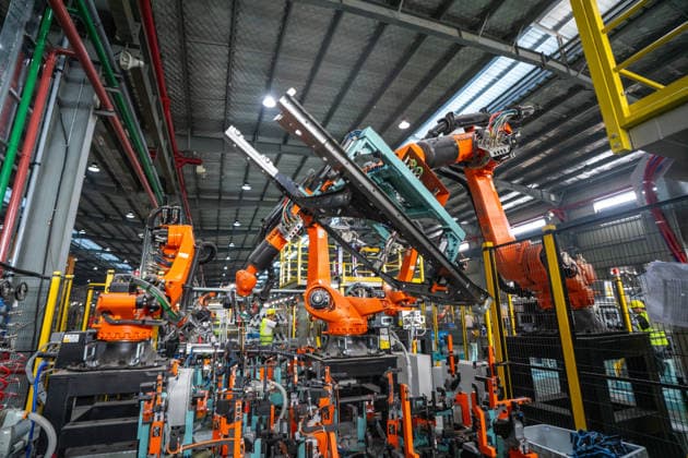 JINHUA, CHINA - JUNE 22: Industrial robots work on the production line at the workshop of new energy vehicle components enterprise on June 22, 2026 in Jinhua, Zhejiang Province of China.  Copyright: xVCGx 111649698781