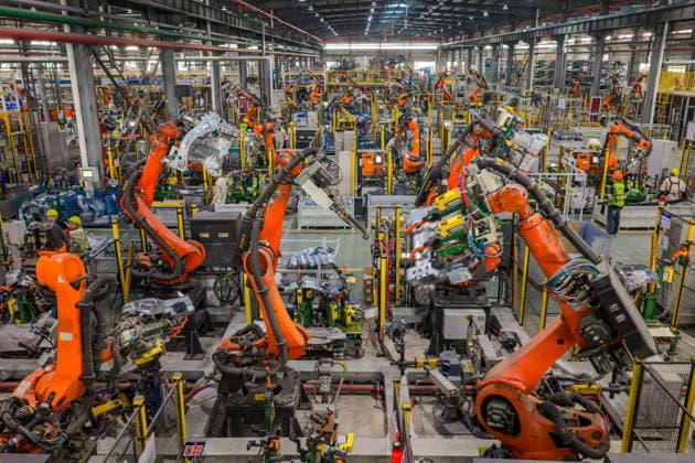 JINHUA, CHINA - JUNE 22: Industrial robots work on the production line at the workshop of new energy vehicle components enterprise on June 22, 2026 in Jinhua, Zhejiang Province of China.  Copyright: xVCGx 111649698759