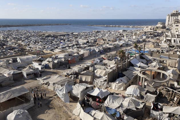 Palestinians displaced by Israeli attacks struggling to survive in makeshift tents GAZA CITY, GAZA, PALESTINE - JUNE 22: Displaced Palestinian families try to sustain their lives with severely limited resources inside an overcrowded makeshift tent camp set up along the Mediterranean coastline of Gaza City, Gaza, Palestine on June 22, 2026. Following more than two years of an intense military blockade and devastating bombardments by Israeli forces, hundreds of thousands of civilians have been forced to flee their homes, finding refuge only in fragile tents or heavily damaged structures. The ongoing conflict has triggered a catastrophic humanitarian crisis, leaving the displaced population struggling daily to access basic necessities such as  Copyright: x2026xAnadoluxAhmedxJihadxIbrahimxAl-arinix