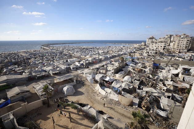 Palestinians displaced by Israeli attacks struggling to survive in makeshift tents GAZA CITY, GAZA, PALESTINE - JUNE 22: Displaced Palestinian families try to sustain their lives with severely limited resources inside an overcrowded makeshift tent camp set up along the Mediterranean coastline of Gaza City, Gaza, Palestine on June 22, 2026. Following more than two years of an intense military blockade and devastating bombardments by Israeli forces, hundreds of thousands of civilians have been forced to flee their homes, finding refuge only in fragile tents or heavily damaged structures. The ongoing conflict has triggered a catastrophic humanitarian crisis, leaving the displaced population struggling daily to access basic necessities such as  Copyright: x2026xAnadoluxAhmedxJihadxIbrahimxAl-arinix