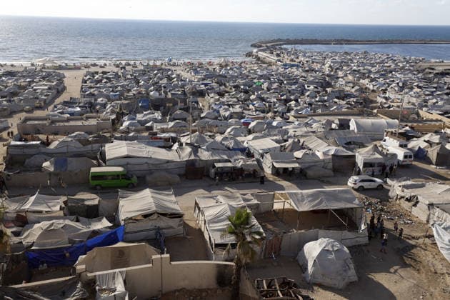 Palestinians displaced by Israeli attacks struggling to survive in makeshift tents GAZA CITY, GAZA, PALESTINE - JUNE 22: Displaced Palestinian families try to sustain their lives with severely limited resources inside an overcrowded makeshift tent camp set up along the Mediterranean coastline of Gaza City, Gaza, Palestine on June 22, 2026. Following more than two years of an intense military blockade and devastating bombardments by Israeli forces, hundreds of thousands of civilians have been forced to flee their homes, finding refuge only in fragile tents or heavily damaged structures. The ongoing conflict has triggered a catastrophic humanitarian crisis, leaving the displaced population struggling daily to access basic necessities such as  Copyright: x2026xAnadoluxAhmedxJihadxIbrahimxAl-arinix