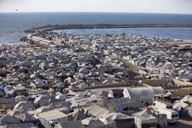 Palestinians displaced by Israeli attacks struggling to survive in makeshift tents GAZA CITY, GAZA, PALESTINE - JUNE 22: Displaced Palestinian families try to sustain their lives with severely limited resources inside an overcrowded makeshift tent camp set up along the Mediterranean coastline of Gaza City, Gaza, Palestine on June 22, 2026. Following more than two years of an intense military blockade and devastating bombardments by Israeli forces, hundreds of thousands of civilians have been forced to flee their homes, finding refuge only in fragile tents or heavily damaged structures. The ongoing conflict has triggered a catastrophic humanitarian crisis, leaving the displaced population struggling daily to access basic necessities such as  Copyright: x2026xAnadoluxAhmedxJihadxIbrahimxAl-arinix