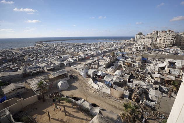 Palestinians displaced by Israeli attacks struggling to survive in makeshift tents GAZA CITY, GAZA, PALESTINE - JUNE 22: Displaced Palestinian families try to sustain their lives with severely limited resources inside an overcrowded makeshift tent camp set up along the Mediterranean coastline of Gaza City, Gaza, Palestine on June 22, 2026. Following more than two years of an intense military blockade and devastating bombardments by Israeli forces, hundreds of thousands of civilians have been forced to flee their homes, finding refuge only in fragile tents or heavily damaged structures. The ongoing conflict has triggered a catastrophic humanitarian crisis, leaving the displaced population struggling daily to access basic necessities such as  Copyright: x2026xAnadoluxAhmedxJihadxIbrahimxAl-arinix
