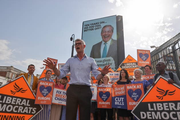June 23, 2026, London, London, UK: London, UK. Dr Al Pinkerton, Liberal Democrat MP for Surrey Heath, addresses party MPs and activists in front of a digital billboard in Fulham, London, during the launch of the party s new national campaign targeting Reform UK leader Nigel Farage and highlighting a Â£5 million gift he received, as the party marks the 10th anniversary of the Brexit referendum with the launch of its nationwide billboard campaign. London UK  - ZUMAl94_ 20260623_zaf_l94_017 Copyright: xDinendraxHariax