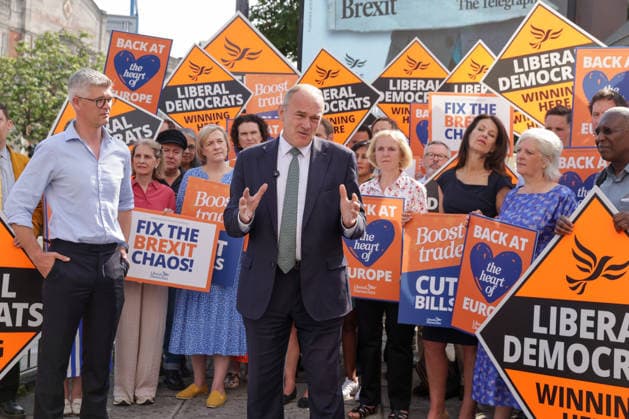 June 23, 2026, London, London, UK: London, UK. Liberal Democrat leader Ed Davey addresses party MPs and activists in front of a digital billboard in Fulham, London, during the launch of a new national campaign targeting Reform UK leader Nigel Farage and highlighting a Â£5 million gift he received, as the party marks the 10th anniversary of the Brexit referendum with the launch of its nationwide billboard campaign. London UK  - ZUMAl94_ 20260623_zaf_l94_026 Copyright: xDinendraxHariax