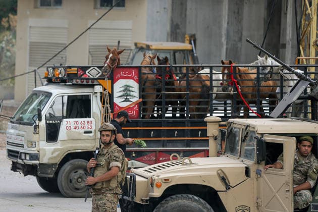 June 23, 2026, Zawtar Al-Gharbieh, Zawtar Al-Gharbieh, Lebanon: Lebanese army soldiers block the entrance of southern Lebanese village of Zawtar al-Gharbieh to prevent villagers from entering the hamlet because of the presence of Israeli forces. Scores of Lebanese who fled their villages started to return to face a devastating shock of finding their homes completely demolished. Following the recent US-Iran deal, residents have attempted to return, only to be met with scenes of rubble and ash. Zawtar Al-Gharbieh Lebanon - ZUMAn313 20260623_zip_n313_006 Copyright: xMarwanxNaamanix