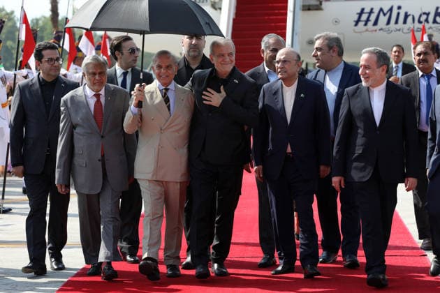 June 23, 2026, Rawalpindi, Pakistan: Pakistan s Prime Minister Shehbaz Sharif (4L), President Asif Ali Zardari (2R), Foreign Minister Ishaq Dar (2L) and Interior Minister Mohsin Naqvi (3R) walking alongside Iran s President Masoud Pezeshkian (4R) and Foreign Minister Abbas Araghchi (R) upon their arrival at the Nur Khan Air Base in Rawalpindi. Iranian Foreign Minister Abbas Araghchi arrived in Islamabad on June 23, Iran s state media reported, as President Masoud Pezeshkian also travelled to Pakistan, which acts as a mediator in talks between Tehran and Washington. Rawalpindi Pakistan - ZUMAi98_ 20260623_zih_i98_012 Copyright: xIranianxPresidencyx