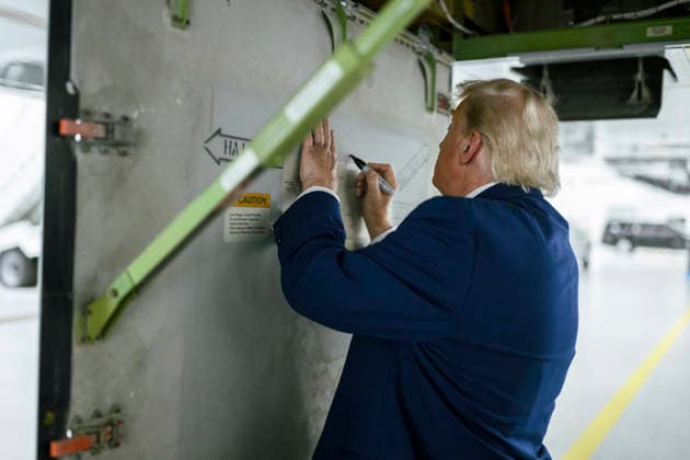 June 23, 2026, Clinton, Md, United States of America: U.S. President Donald Trump autographs the former Qatari Royal Family Boeing 747-8 airliner, now refurbished as Air Force One at the Presidential Airlift Group hangar at Joint Base Andrews, June 19, 2026 in Clinton, Maryland. The aircraft was gifted to President Donald Trump by the House of Thani is officially U.S Air Force VC-25B Bridge aircraft replacing Air Force One after final testing. Clinton United States of America - ZUMAp138 20260623_zaa_p138_003 Copyright: xDanielxTorok WhitexHousex