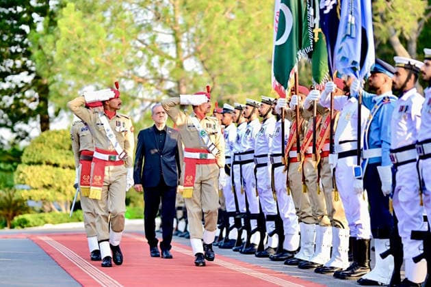 June 23, 2026, Peshawar, Peshawar, Pakistan: Iranian President Masoud Pezeshkian Reviews Honor Guard During Welcome Ceremony in Islamabad..Islamabad, Pakistan, June 23, 2026: Masoud Pezeshkian reviews an honor guard during an official welcome ceremony in Islamabad on June 23, 2026. Pezeshkian is in Pakistan to participate in ongoing diplomatic discussions and U.S.-Iran peace talks hosted by Pakistan. The visit underscores efforts to promote regional dialogue, diplomatic engagement, and international cooperation. Peshawar Pakistan  - ZUMAa217 20260623_znp_a217_040 Copyright: xHussainxAlix
