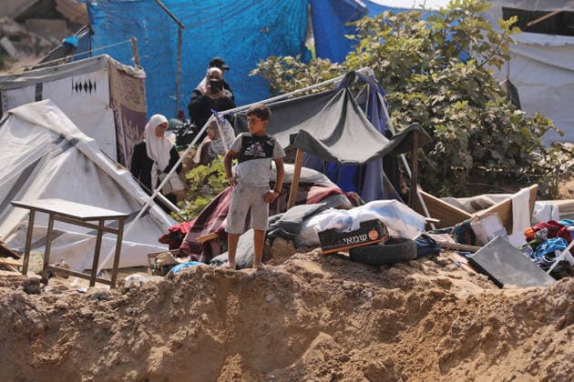Displaced Palestinians inspect damaged tents after strike in Gaza City Displaced Palestinians inspect their heavily damaged tents near a displacement camp in the Sheikh Ajlin neighborhood, west of Gaza City, on June 24, 2026. An Israeli military strike overnight hit the coastal area where thousands of displaced families have sought shelter, leaving a large crater and causing extensive damage to displacement tents despite a ceasefire agreement being in force. Photo by Belal Osama apaimages Gaza Gaza Strip Palestinian Territory 240626_Gaza_BO_00(53) Copyright: xapaimagesxBelalxOsamax xapaimagesx
