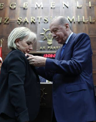 AK Party Group Meeting in Ankara ANKARA, TURKIYE - JUNE 24: ----EDITORIAL USE ONLY - MANDATORY CREDIT - TURKISH PRESIDENCY MURAT KULA HANDOUT - NO MARKETING NO ADVERTISING CAMPAIGNS - DISTRIBUTED AS A SERVICE TO CLIENTS----) Turkish President and Chairman of the Justice and Development (AK) Party Recep Tayyip Erdogan pins the official party badge onto the lapel of Istanbul Member of Parliament Nimet Ozdemir during the his party s parliamentary group meeting at the Grand National Assembly of Turkiye (GNAT) in Ankara, Turkiye, on June 24, 2026. Turkish Presidency Murat Kula Handout Anadolu Ankara Turkey. Editorial use only. Please get in touch for any other usage.  Copyright: x2026xAnadoluxTurkishxPresidencyx xMuratxKulax xHandoutx