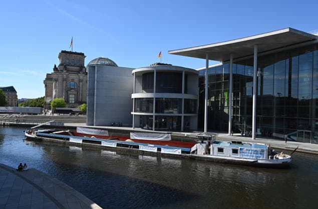Cargo ship blocks Spree River during rally in Berlin BERLIN, GERMANY - JUNE 24: A cargo ship blocks the Spree River in front of the Reichstag building and the Paul-Lobe-Haus during a demonstration organized by MIRO, the German minerals and aggregates industry association, in Berlin, Germany, on June 24, 2026. The vessel, loaded with construction aggregates, was used to draw attention to calls for stronger legal protection of mineral deposits and greater consideration of domestic mineral resource extraction and processing in spatial planning legislation. Volodymyr Sindieiev Anadolu Berlin Germany. Editorial use only. Please get in touch for any other usage.  Copyright: x2026xAnadoluxVolodymyrxSindieievx