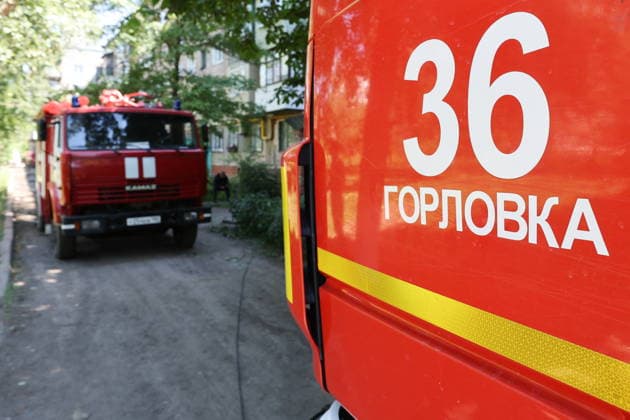 RUSSIA, GORLOVKA - JUNE 24, 2026: Trucks of the Russian Emergencies Ministry are seen by an apartment block destroyed in a drone attack. Dmitry Yagodkin TASS  94215020