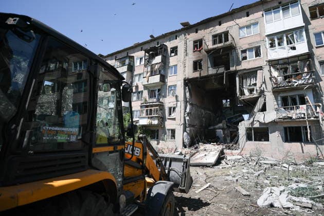 RUSSIA, GORLOVKA - JUNE 24, 2026: Machinery of the Russian Emergencies Ministry is seen by an apartment block destroyed in a drone attack. Dmitry Yagodkin TASS  94215081