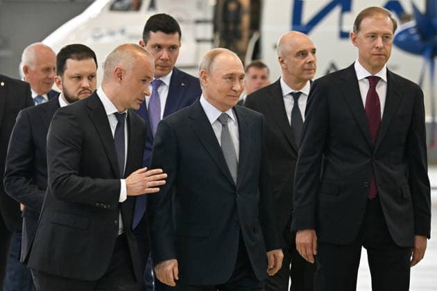 RUSSIA, ZHUKOVSKY - JUNE 24, 2026: United Aircraft Corporation (UAC) General Director Vadim Badekha, Russia s President Vladimir Putin, and Russia s First Deputy Prime Minister Denis Manturov (L-R front) visit Gromov Flight Research Institute in Zhukovsky, some 40 km southeast of Moscow. Yuri Kochetkov POOL TASS  94217619