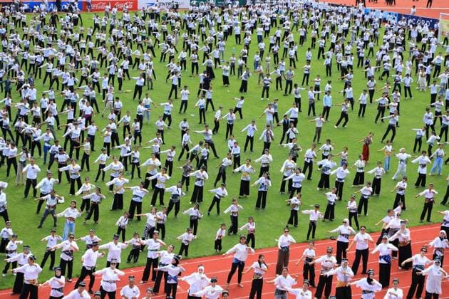 Traditional Andijan Polka dance performance enters Guinness World Records in Uzbekistan ANDIJAN, UZBEKISTAN - JUNE 24: Hundreds of performers dressed in traditional attire fill the entire field and running tracks of a stadium to perform the iconic national folk dance, Andijan polka, simultaneously in Andijan, Uzbekistan on June 24, 2026. The mass synchronized cultural event, which saw the participation of approximately 500 people, successfully entered the Guinness World Records. Bahtiyar Abdülkerimov Anadolu Andijan Uzbekistan. Editorial use only. Please get in touch for any other usage.  Copyright: x2026xAnadoluxBahtiyarxAbdülkerimovx