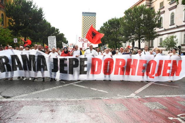 Demonstrations over controversial Vlora tourism project enter 25th day in Tirana TIRANA, ALBANIA - JUNE 24: Protesters gather at Skanderbeg Square despite the rain on the 25th day of demonstrations against a planned tourism development project in the Zvernec region of Vlora, holding banners with the slogan Albania is not for sale in Tirana, Albania on June 24, 2026. Olsi Shehu Anadolu Tirana World. Editorial use only. Please get in touch for any other usage.  Copyright: x2026xAnadoluxOlsixShehux