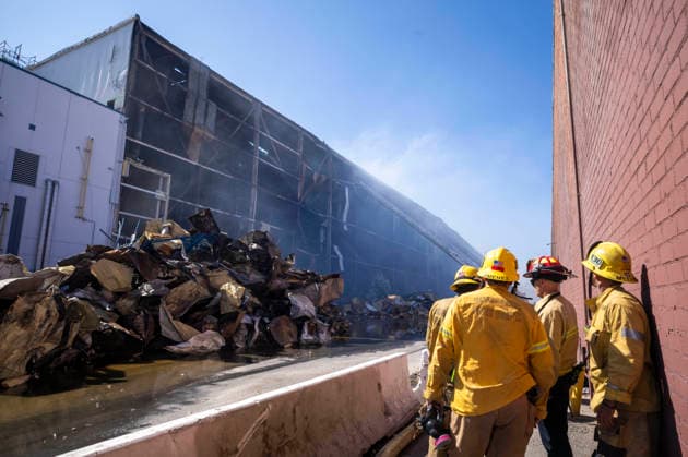 June 24, 2026, Los Angeles, California, USA: A pile of fire-damaged materials lines the outside of a warehouse as firefighters continue working at the scene of a warehouse fire in the Boyle Heights neighborhood of Los Angeles on Wednesday, June 24, 2026. Los Angeles USA - ZUMAc68_ 20260624_zaf_c68_002 Copyright: xRingoxChiux