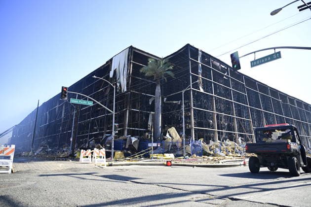 Lineage Warehouse Fire Day 8 The front of the Lineage Logistics cold storage warehouse walls has collapsed following a large structural fire that severely weakened the facility, exposing the building’s interior where damaged racking and debris remain visible. Firefighters continue to operate in and around the compromised structure as crews assess stability and work to contain remaining hotspots amid ongoing safety concerns. Los Angeles United States Copyright: xWestonxHancockx xSOPAxImagesx Weston Hancock June 24 - 1929