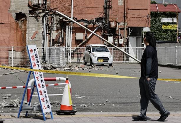 Powerful earthquake hits northeastern Japan Debris from a building s exterior wall is scattered across a parking lot in Hachinohe in Aomori Prefecture, on June 25, 2026, after a preliminary magnitude-7.2 earthquake hit northeastern Japan.  A14AA0005620164P