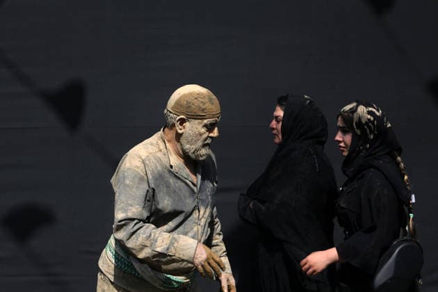 Mourners commemorate Karbala martyrs on Ashura in Iran??????? TEHRAN, IRAN - JUNE 25: Members of the Lur ethnic community take part in the traditional Gil-mali (mud-smearing) ritual during Ashura commemorations at Osshaghol Abbas Hosseiniyeh in Tehran, Iran, on June 25, 2026. Marking the anniversary of the martyrdom of Imam Hussein, the grandson of Prophet Muhammad, and his 72 companions in Karbala, participants covered themselves in mud as a sign of mourning and remembrance. Fatemeh Bahrami Anadolu Tehran Iran. Editorial use only. Please get in touch for any other usage.  Copyright: x2026xAnadoluxFatemehxBahramix