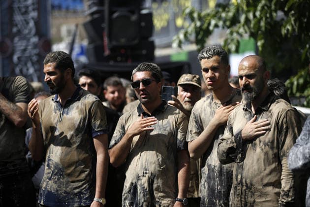 Mourners commemorate Karbala martyrs on Ashura in Iran??????? TEHRAN, IRAN - JUNE 25: Members of the Lur ethnic community take part in the traditional Gil-mali (mud-smearing) ritual during Ashura commemorations at Osshaghol Abbas Hosseiniyeh in Tehran, Iran, on June 25, 2026. Marking the anniversary of the martyrdom of Imam Hussein, the grandson of Prophet Muhammad, and his 72 companions in Karbala, participants covered themselves in mud as a sign of mourning and remembrance. Fatemeh Bahrami Anadolu Tehran Iran. Editorial use only. Please get in touch for any other usage.  Copyright: x2026xAnadoluxFatemehxBahramix