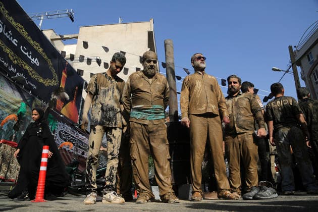 Mourners commemorate Karbala martyrs on Ashura in Iran??????? TEHRAN, IRAN - JUNE 25: Members of the Lur ethnic community take part in the traditional Gil-mali (mud-smearing) ritual during Ashura commemorations at Osshaghol Abbas Hosseiniyeh in Tehran, Iran, on June 25, 2026. Marking the anniversary of the martyrdom of Imam Hussein, the grandson of Prophet Muhammad, and his 72 companions in Karbala, participants covered themselves in mud as a sign of mourning and remembrance. Fatemeh Bahrami Anadolu Tehran Iran. Editorial use only. Please get in touch for any other usage.  Copyright: x2026xAnadoluxFatemehxBahramix