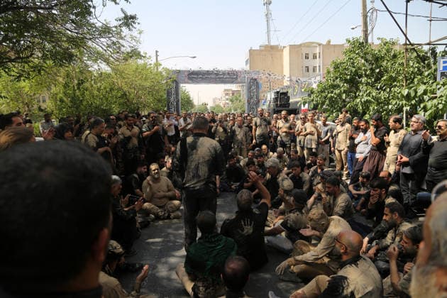 Mourners commemorate Karbala martyrs on Ashura in Iran??????? TEHRAN, IRAN - JUNE 25: Members of the Lur ethnic community take part in the traditional Gil-mali (mud-smearing) ritual during Ashura commemorations at Osshaghol Abbas Hosseiniyeh in Tehran, Iran, on June 25, 2026. Marking the anniversary of the martyrdom of Imam Hussein, the grandson of Prophet Muhammad, and his 72 companions in Karbala, participants covered themselves in mud as a sign of mourning and remembrance. Fatemeh Bahrami Anadolu Tehran Iran. Editorial use only. Please get in touch for any other usage.  Copyright: x2026xAnadoluxFatemehxBahramix