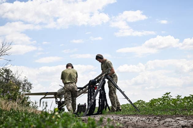 Technicians prepare to launch a Ukrainian Raybird (ACS-3) UAV from a catapult during an aerial reconnaissance mission by soldiers of the 148th Separate Artillery Zhytomyr Brigade of the Ukrainian Airborne Forces in the Oleksandrivka sector, Dnipropetrovsk region, Ukraine, June 22, 2026. (Photo by Dmytro Smolienko Ukrinform) Aerial reconnaissance by Ukraine’s 148th Artillery Brigade in Oleksandrivka sector  Copyright: xDmytroxSmolienkox