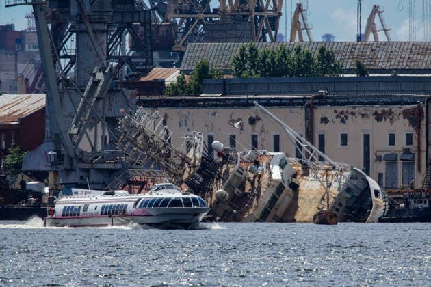 RUSSIA, ST PETERSBURG - JUNE 25, 2026: Salvage operations are underway for the Kapitan Ushakov tugboat at the Baltic Shipyard. The vessel partially sank on 8 August 2025, after listing to its starboard during construction work; no injuries reported. The damage was estimated by specialists from the North-Western Interregional Directorate of the Federal Service for Supervision of Natural Resources (Rosprirodnadzor) at 651 million rubles. Peter Kovalev TASS  94260494