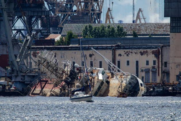 RUSSIA, ST PETERSBURG - JUNE 25, 2026: Salvage operations are underway for the Kapitan Ushakov tugboat at the Baltic Shipyard. The vessel partially sank on 8 August 2025, after listing to its starboard during construction work; no injuries reported. The damage was estimated by specialists from the North-Western Interregional Directorate of the Federal Service for Supervision of Natural Resources (Rosprirodnadzor) at 651 million rubles. Peter Kovalev TASS  94260497
